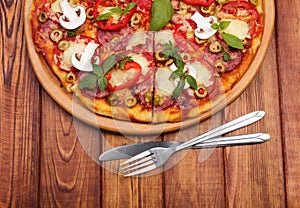 Pizza with herbs and fork