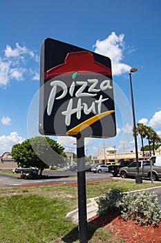 Pizza Hut sign. Pizza Hut is one of the largest franchised restaurants in the world with over 12,000 locations