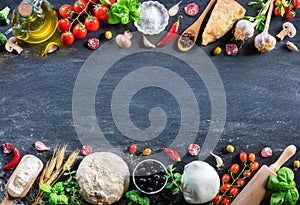 Pizza Ingredients On Black Table In A Raw