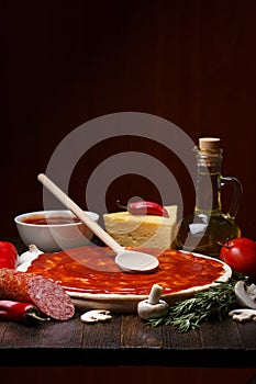 Pizza ingredients on table