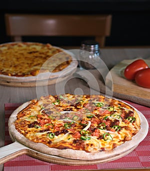 Pizza with italian meat chile tomato sauce and cheese photo