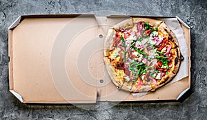 Pizza with jamon in a box