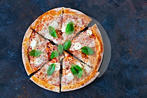Pizza margarita with tomato sauce, fresh mozzarella, parmesan an