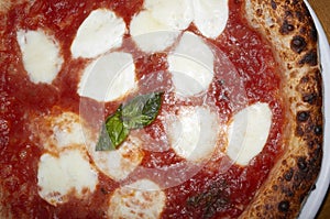 Pizza Margherita with basil close up for lunch