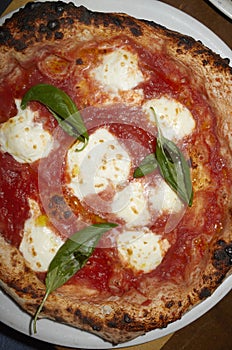 Pizza margherita with basil close up for lunch