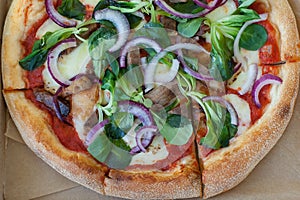 Pizza Margherita on black stone background. Homemade Pizza Margarita with Tomatoes, Basil and Mozzarella Cheese