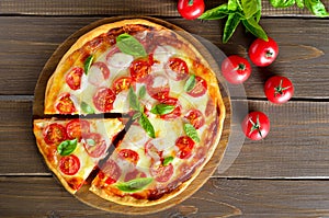 Pizza Margherita on cutting board