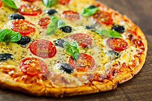 Pizza Margherita or Margarita with Mozzarella cheese, tomato, olive.