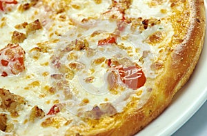 Pizza with mozzarella, chedar and tomatoes