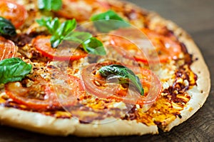 Pizza with Mozzarella cheese, Tomatoes, pepper, Spices and Fresh Basil. Italian pizza. Pizza Margherita or Margarita.