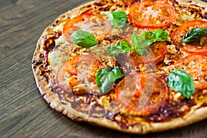 Pizza with Mozzarella cheese, Tomatoes, pepper, Spices and Fresh Basil. Italian pizza. Pizza Margherita or Margarita.