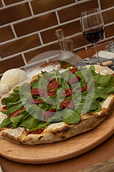 Pizza  rucula and dried tomato