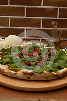 Pizza  rucula and dried tomato