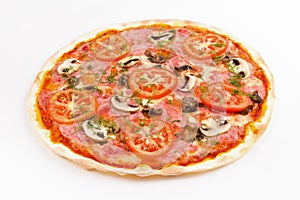 Pizza with mushrooms, ham and tomatoes on a white background.