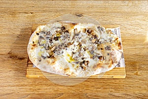 Pizza with mushrooms, mozzarella cheese, olive oil and thin