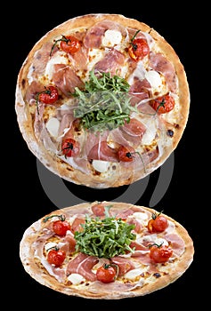 Pizza with Parma ham, mozzarella and cherry tomatoes. On dark background