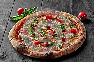 Pizza with pelati sauce, cabanossi, salami, bacon, ham