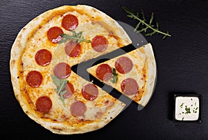 Pizza peperoni on stone black try