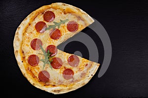 Pizza peperoni on stone black try