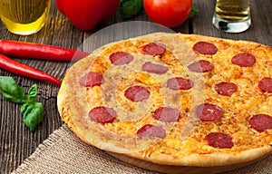 Pizza pepperoni unsliced traditional food on