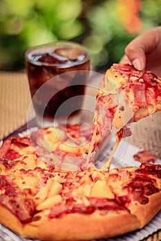 Pizza picture with a glass of sparkling water. Blurred background