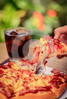 Pizza picture with a glass of sparkling water. Blurred background