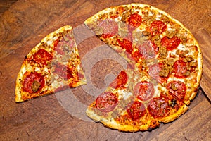 Pizza pie with a quarter removed to demonstrate math fractions.