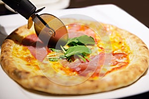 Pizza and pizza cutter