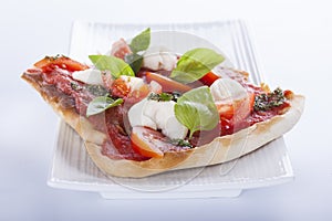 Pizza pomodoro, vegetarian and homemade on white backgr