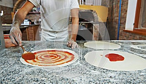 Pizza preparartion at pizzeria