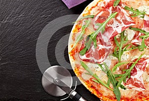 Pizza with prosciutto and mozzarella photo