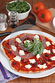 Pizza with prosciutto and ricotta cheese