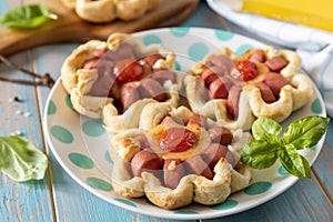 Pizza in puff pastry with cheese and tomatoes