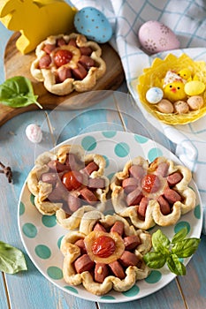 Pizza in puff pastry with cheese and tomatoes