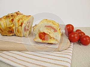 Pizza pull-apart bread with tomatoes and cheese