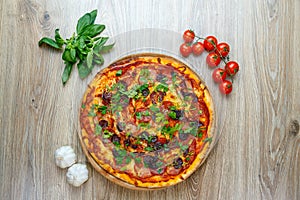 Pizza quattro carni, sausage, salami, ham, tomato sauce and parsley top