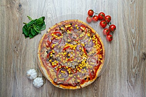 Pizza with red sauce, ham, mozarella, corn, onion rings, red bell pepper, mushroom top