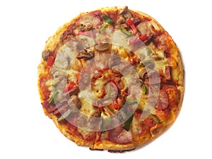 Pizza in round shape, topped with meat, ham, mushroom and veggies