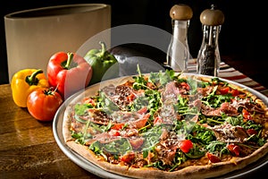Pizza with rucola and Black Forest ham