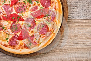 pizza with salami and red pepper