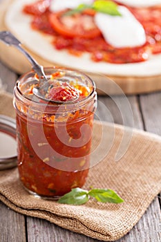 Pizza sauce in a jar selective focus