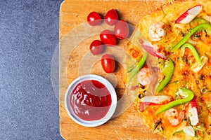 Pizza with seafood paprika and tomatoes