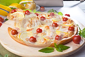 Pizza with seafood red fish, salmon, shrimp, tomatoes, still life, cheese, stretches, shoulder, slice, rises