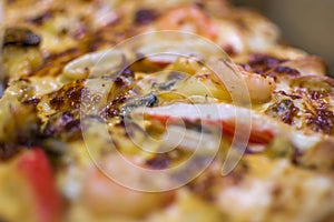 Pizza served on wooden circle board