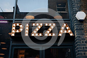Pizza sign outside a restaurant in East London, UK