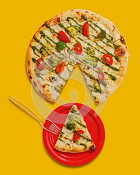 Pizza with a slice cut off on a red plate. yellow background