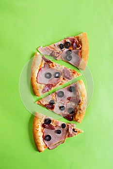 Pizza slices on a green background