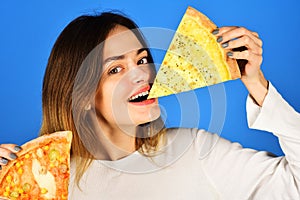 Pizza time. Smiling girl with two tasty slices of pizza. Fast food. Snack. Pizza delivery. Lunch or dinner. Woman eating