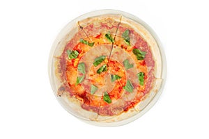 Pizza with tomato sauce and basil on white isolated background. Top view, close-up