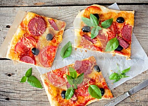 Pizza with tomatoes, cheese and salami